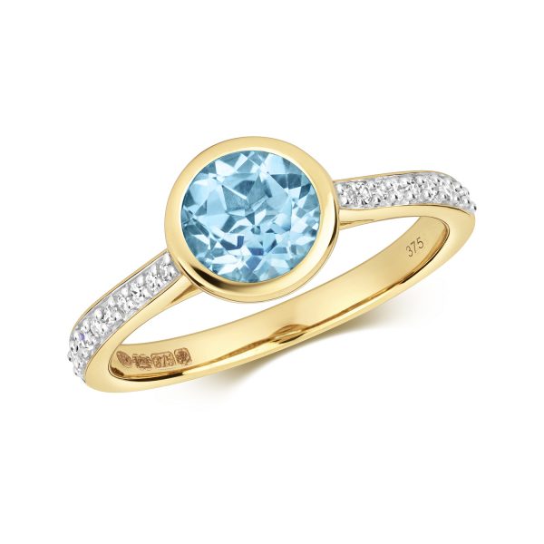 9 carat yellow gold blue topaz and diamond ring