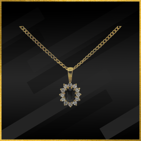 9 carat yellow gold sapphire and cubic zirconia pendant and chain.
