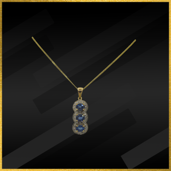 9 carat yellow gold sapphire and diamond pendant and chain with a bolt ring catch.