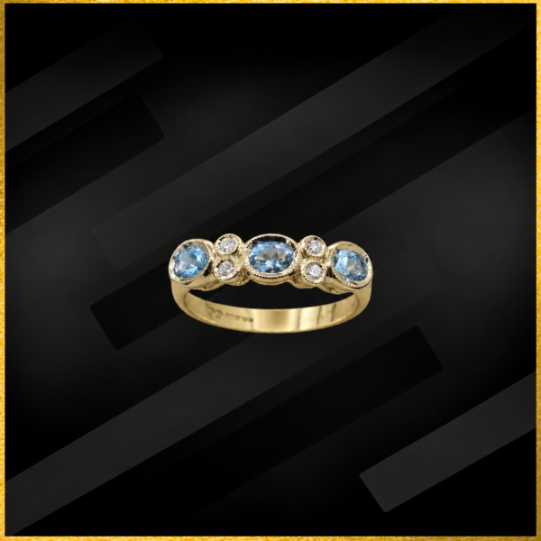 18 carat gold blue topaz and diamond ring