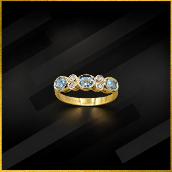 9 carat yellow gold blue topaz and diamond ring