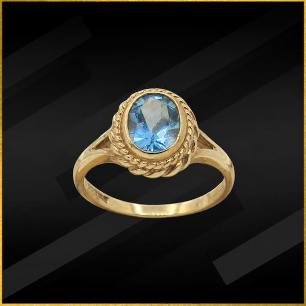 9 carat yellow gold blue topaz ring