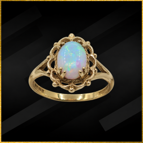 A beautiful 9 carat yellow gold created opal ring