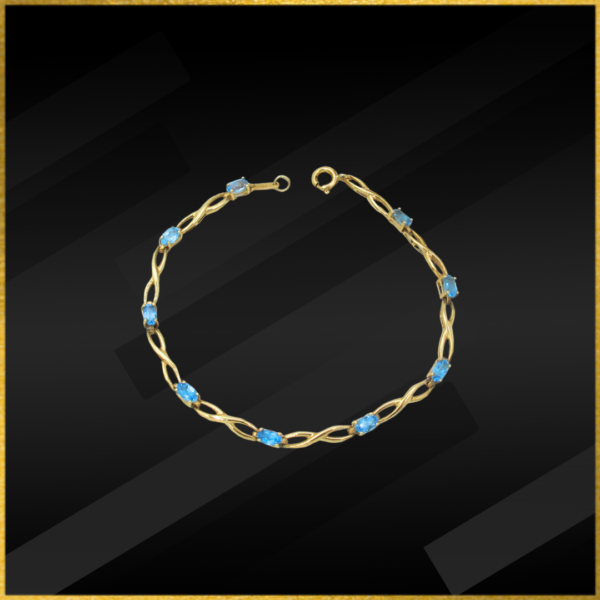 9 carat yellow gold blue topaz bracelet