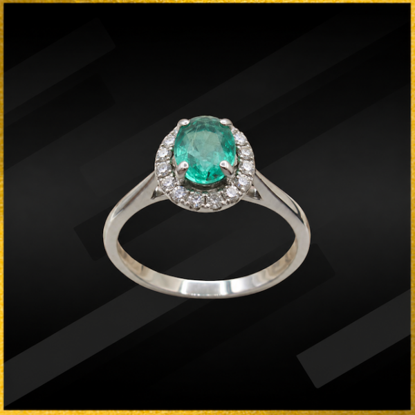 9 carat white gold emerald and diamond ring
