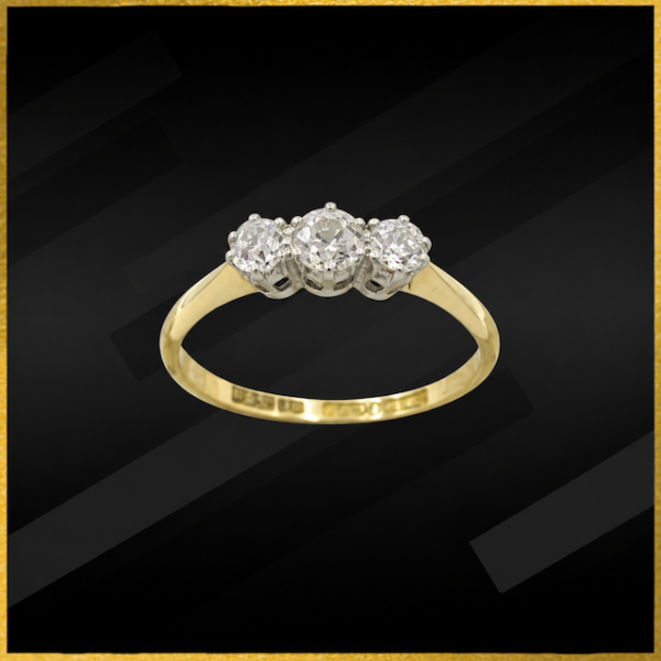 18 Carat yellow gold three stone diamond ring