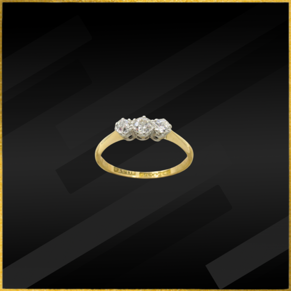 18 Carat yellow gold three stone diamond ring