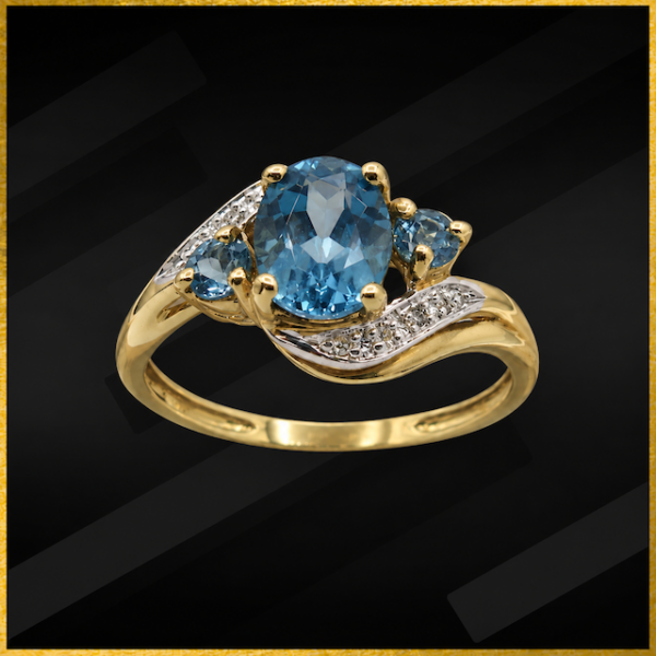 9 carat yellow gold blue topaz and diamond ring