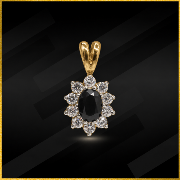 9 carat yellow gold sapphire and cz pendant.