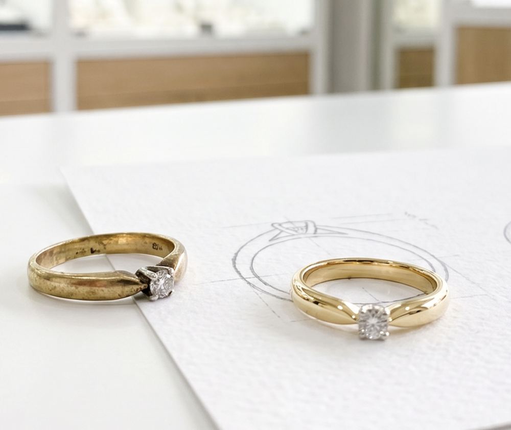 An old, worn gold solitaire ring beside its redesigned replacement and the design sketch